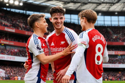 Arsenal F.C. players celebrating during a football match
