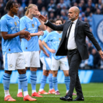 Manchester City Transfer News : coach speaking with players during a football match