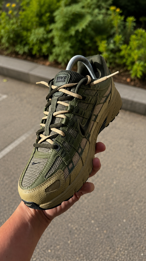 Green Nike P6000 sneaker close-up showing detailed design